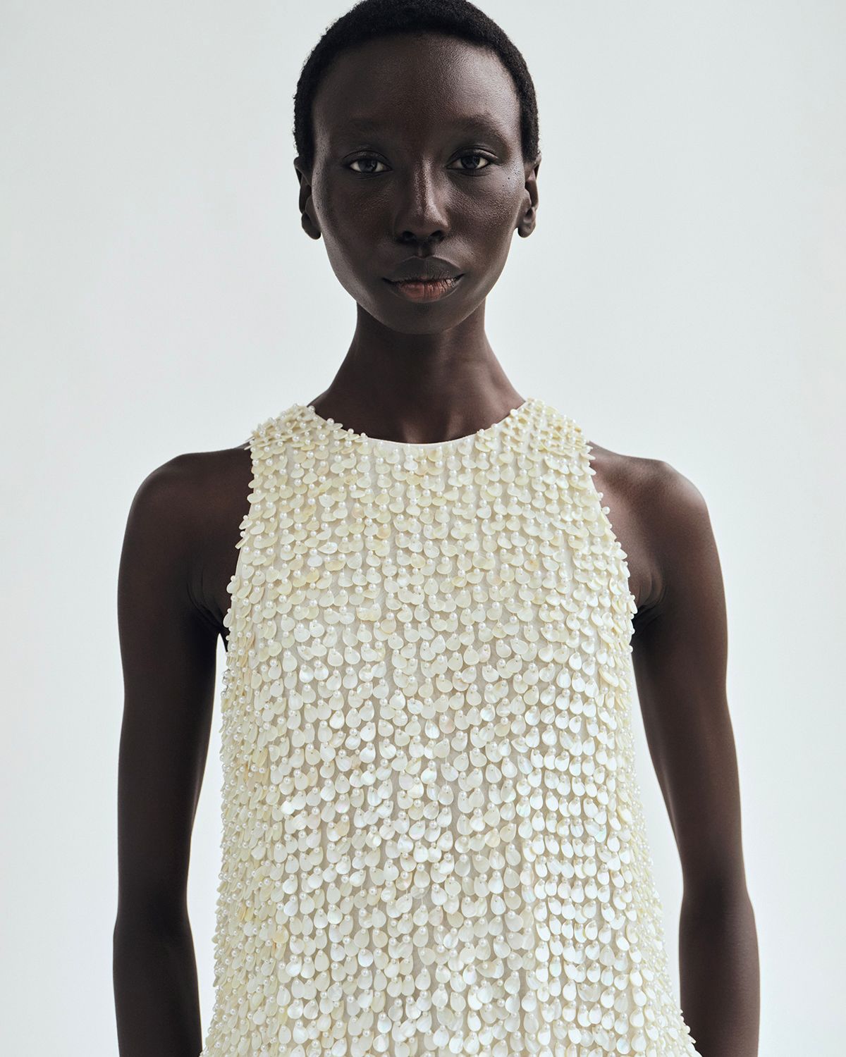 lookbook image of model wearing the Rami Top In Embroidered Mother of Pearl Ivory 