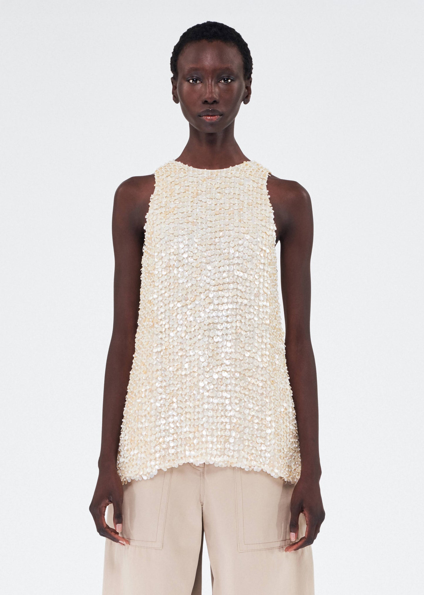 Front of model wearing the Rami Top in Embroidered Mother of Pearl